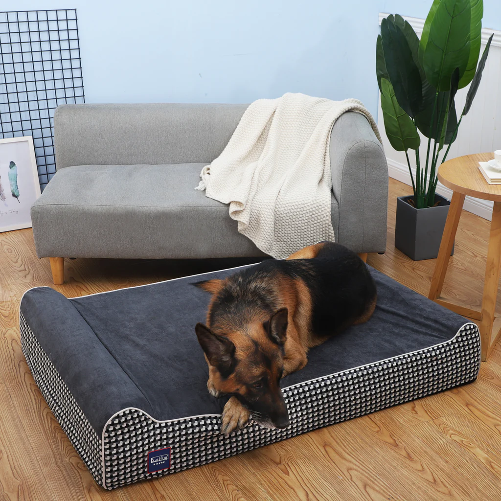 A large dog laying comfortably on an orthopaedic dog bed, suitable for large and extra-large breeds, providing ample space and support for a restful sleep.